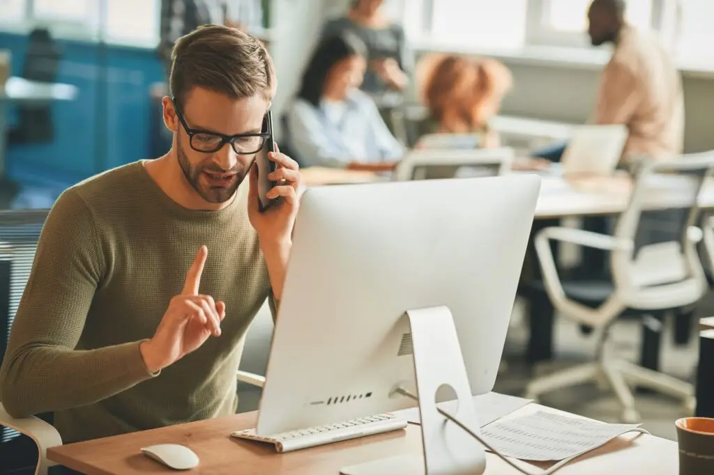 Patient call-center operator gesturing during a phone-call